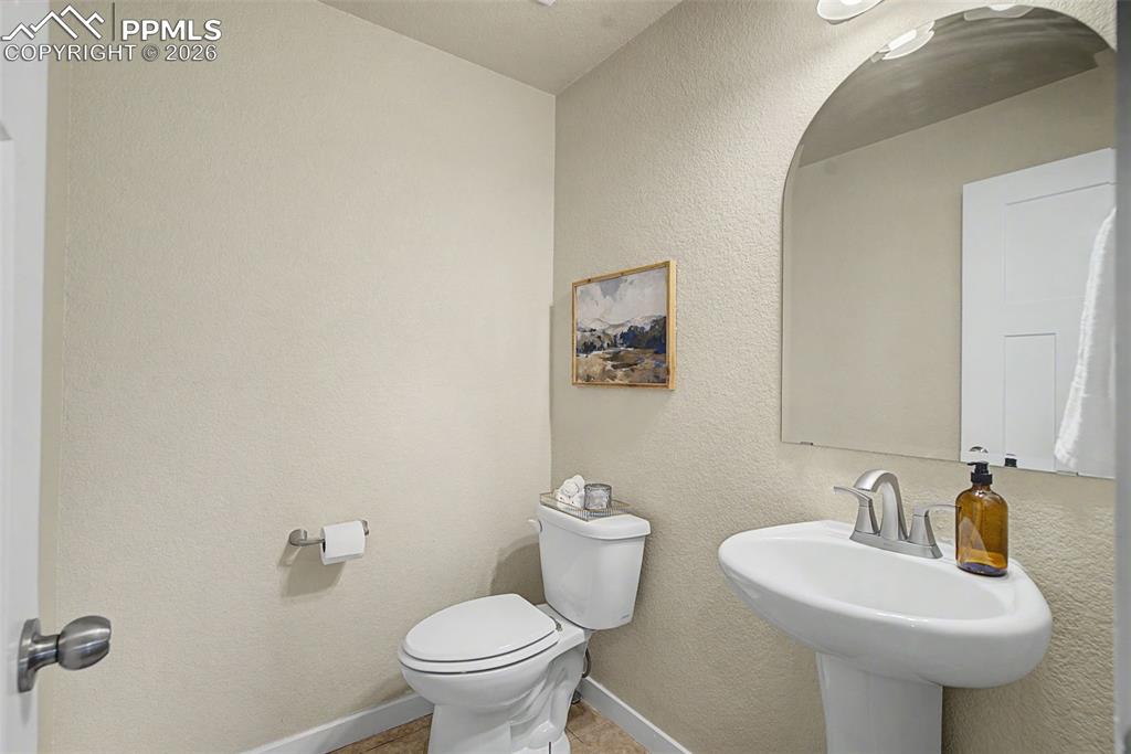 Image 24 of 30: Main level half-bath
