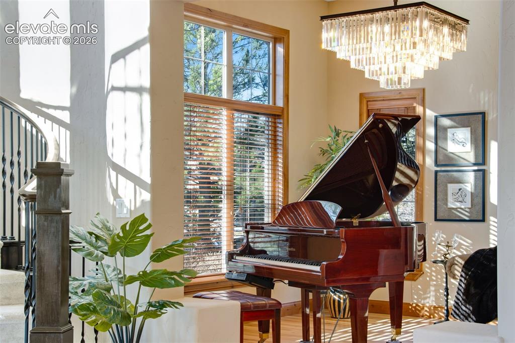 Image 26 of 50: Front piano room or formal living room