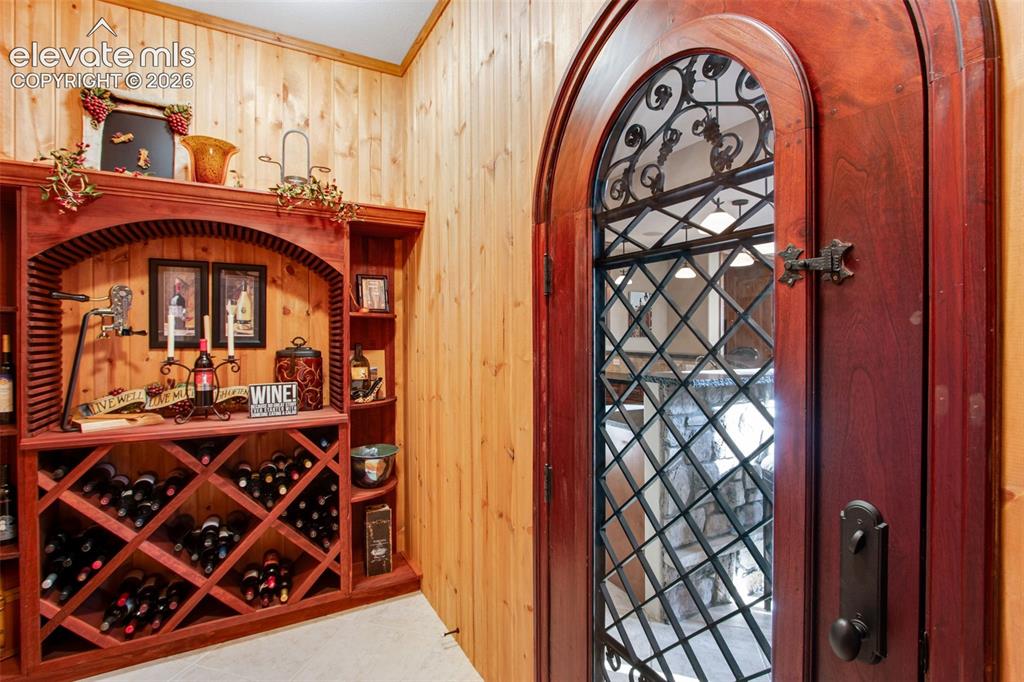 Image 45 of 50: Wine cellar Tucked discreetly in a quiet corner features multiple storage o