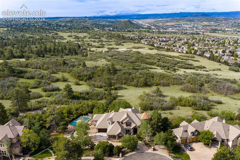 Image 46 of 50: 1 acre featuring mature landscaping, sprinkler and drip plus backs to hundr