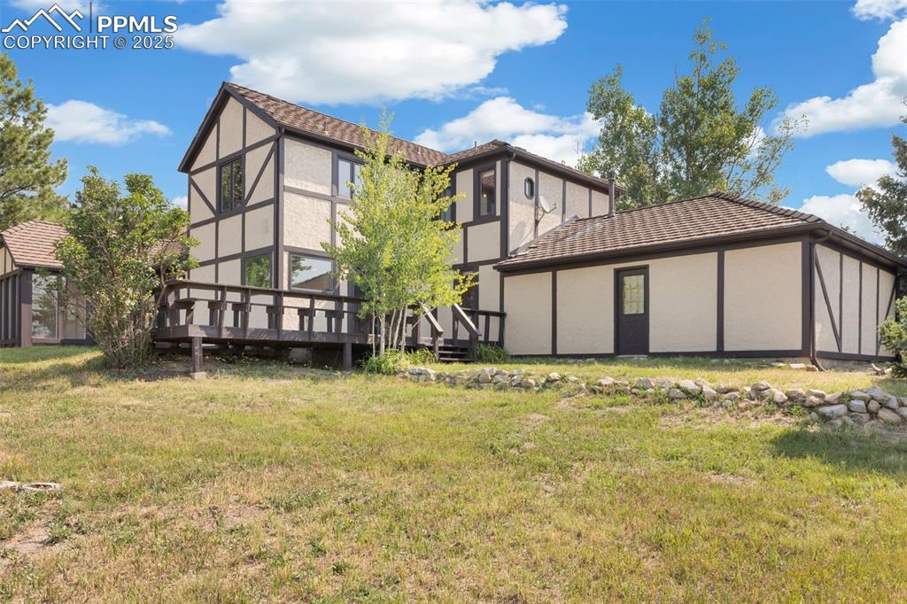 Image 28 of 35: Wood Deck with Built in Seating!