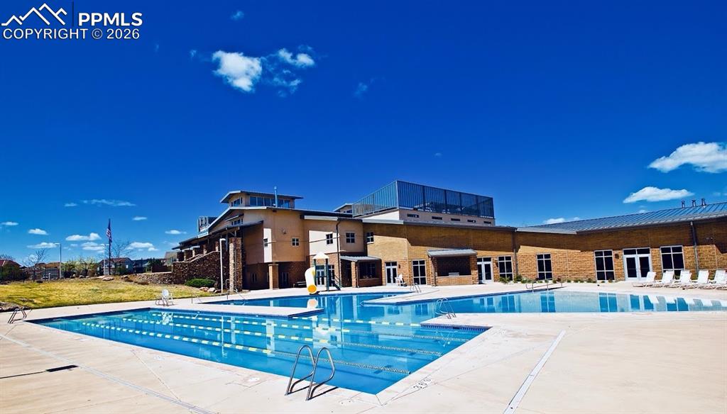 Image 38 of 41: Meridian ranch rec center is for residents only, features an outdoor pool, 