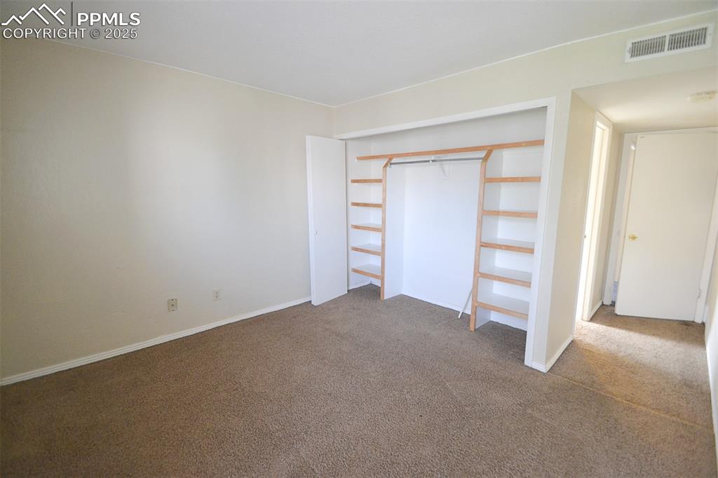 Image 14 of 31: Unfurnished bedroom featuring carpet flooring and a closet