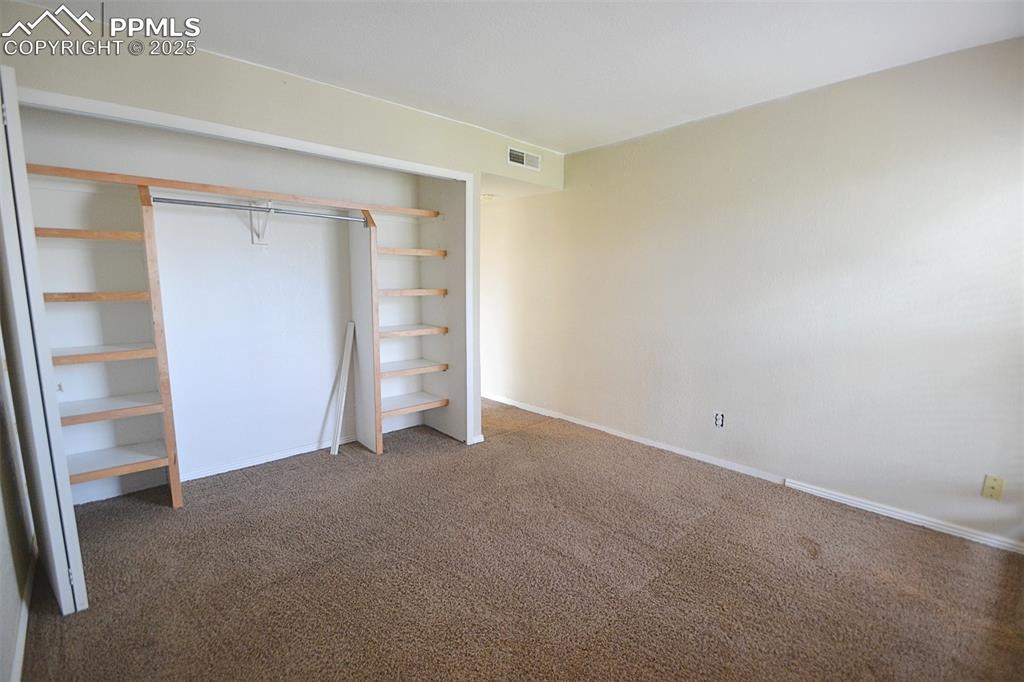 Image 15 of 31: Unfurnished bedroom featuring carpet flooring and a closet