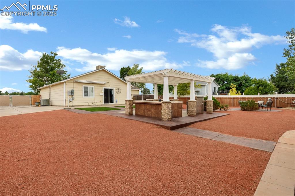 Image 17 of 39: Outdoor Kitchen featuring a pergola and a patio area