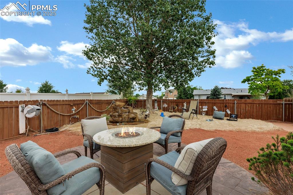 Image 19 of 39: Beach Waterfall area and natural gas line, outdoor fire pit