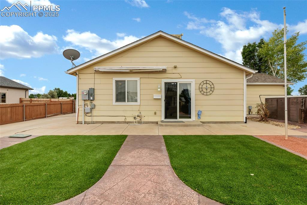 Image 24 of 39: Rear view of property using artificial turf