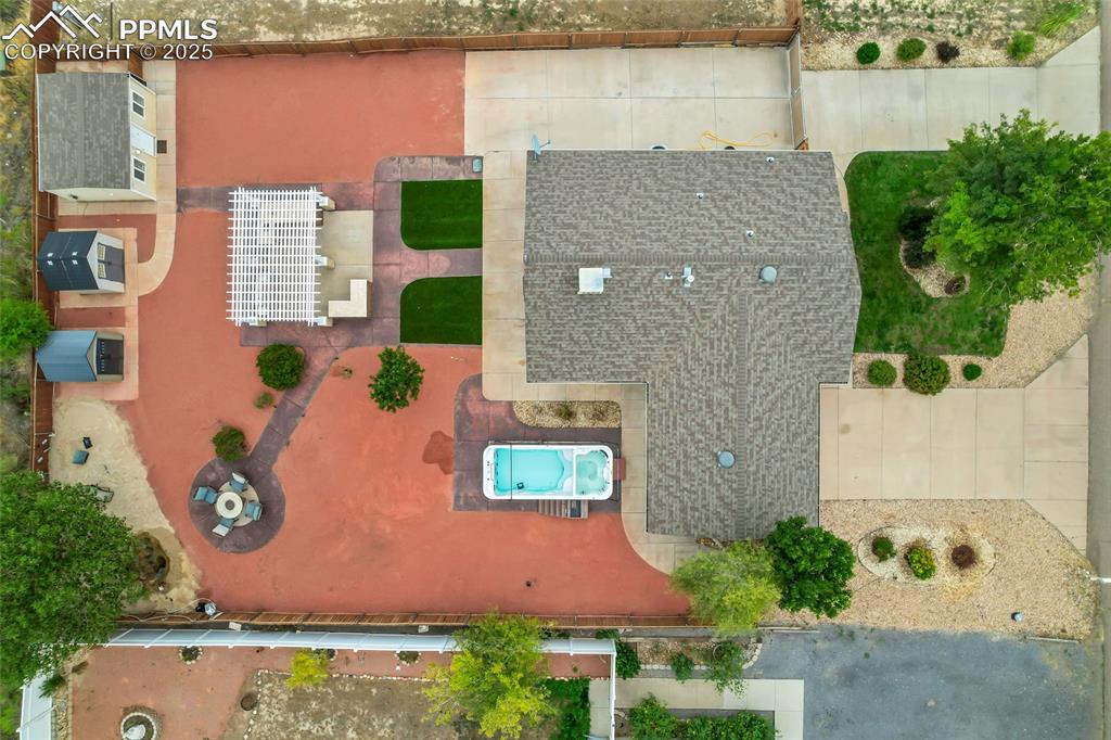 Image 33 of 39: Aerial of pool, fire pit, pergola covering outdoor kitchen & Corner Beach a