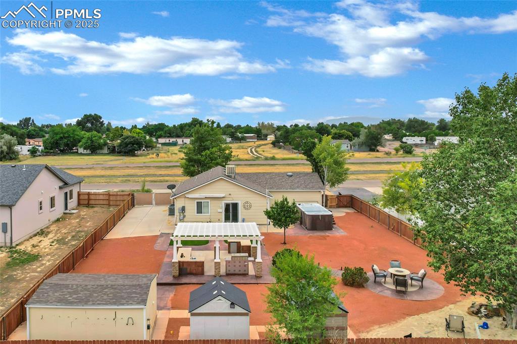 Image 38 of 39: Pool House, outdoor kitchen, Fire pit with natural gas ran, Beach play sand