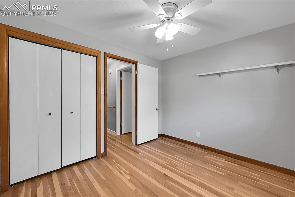 Image 16 of 27: Unfurnished bedroom with light wood finished floors, a closet, and ceiling 
