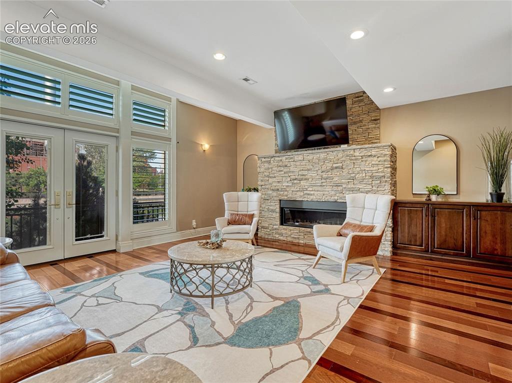 Image 4 of 42: Multi-feature stone-surround fireplace.