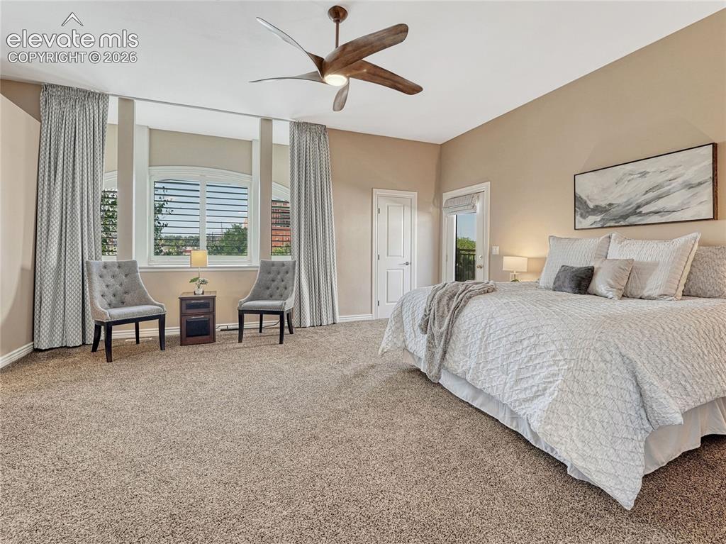 Image 6 of 42: Primary suite with dual walk-in closets and private deck.