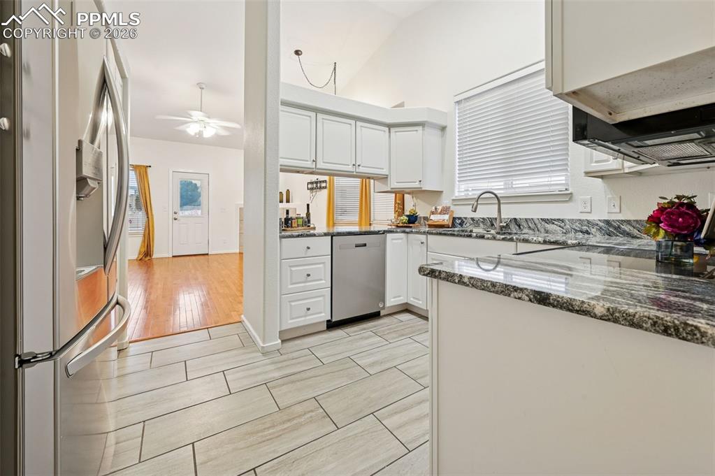 Image 12 of 37: Bright and cheerful white kitchen