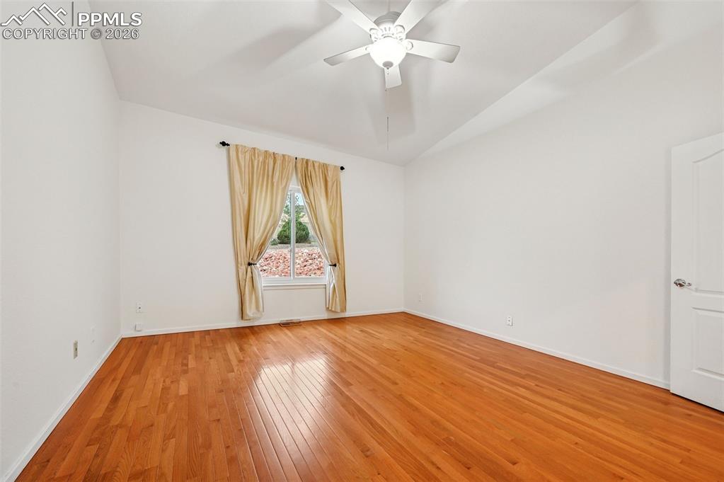 Image 20 of 37: Vaulted ceiling and fan