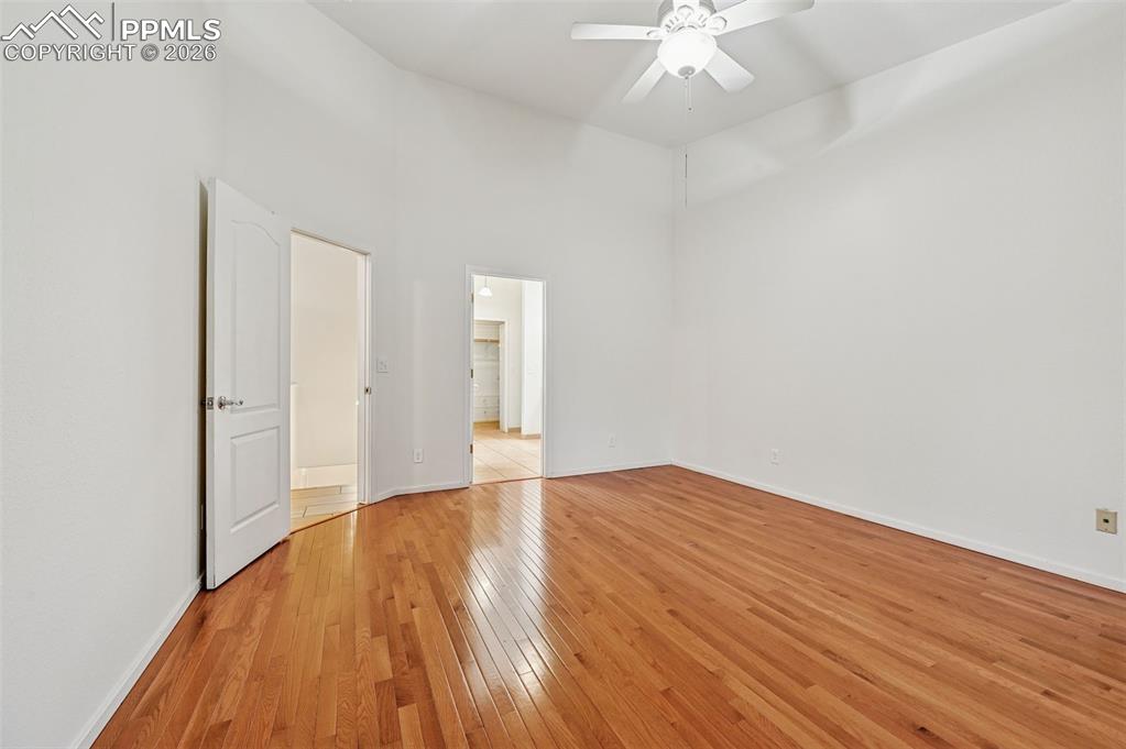 Image 22 of 37: Back to main level to the left and into the ensuite bathroom to the right