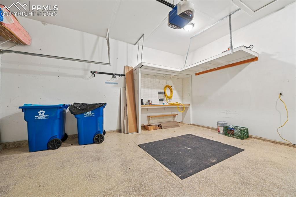 Image 35 of 37: Pegboard and epoxy floor