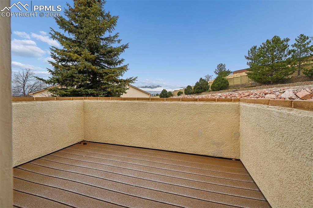 Image 6 of 37: Composite and stucco deck with mountains in the background.