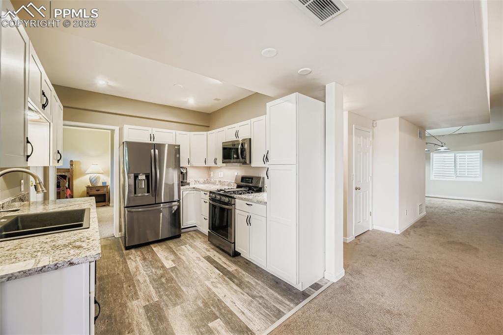 Image 31 of 47: Basement Kitchen