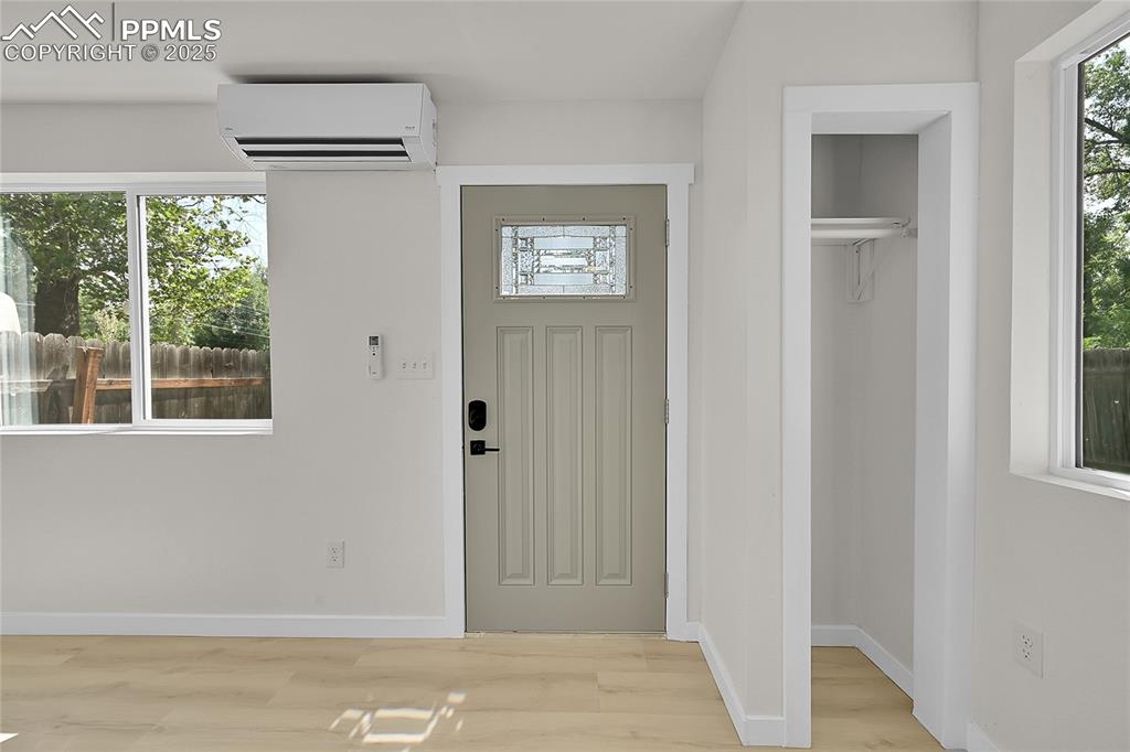 Image 5 of 29: Entrance foyer with healthy amount of natural light, light wood-style floor