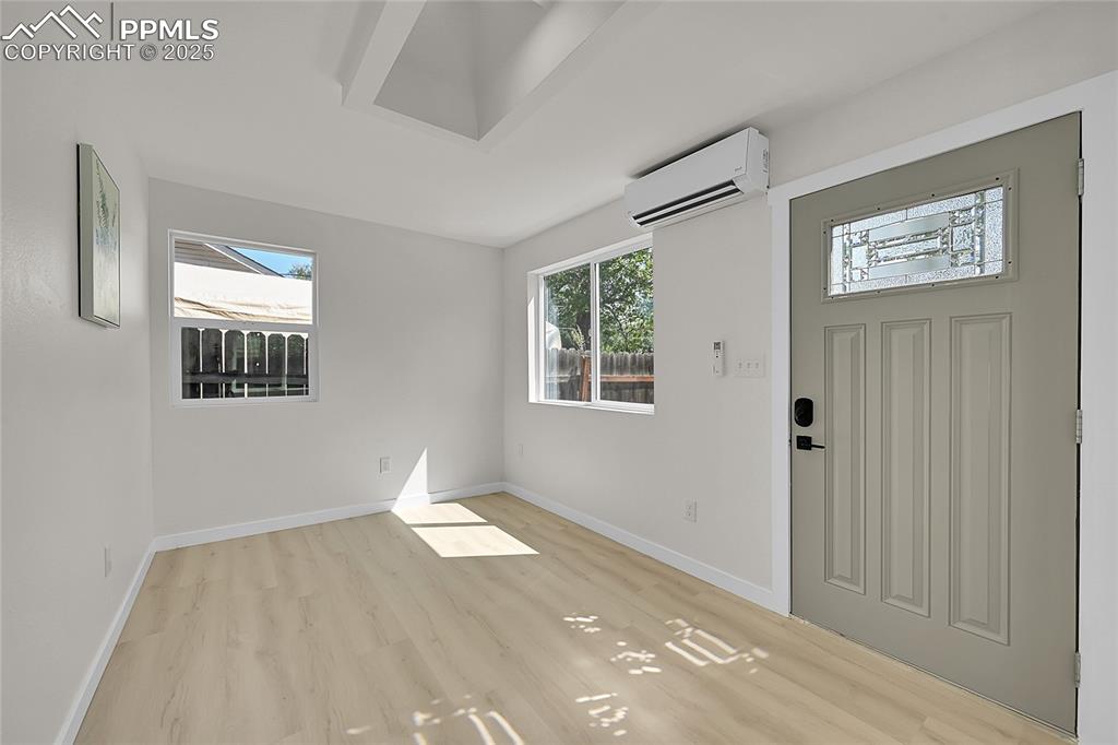 Image 6 of 29: Foyer entrance featuring healthy amount of natural light, light wood-style 