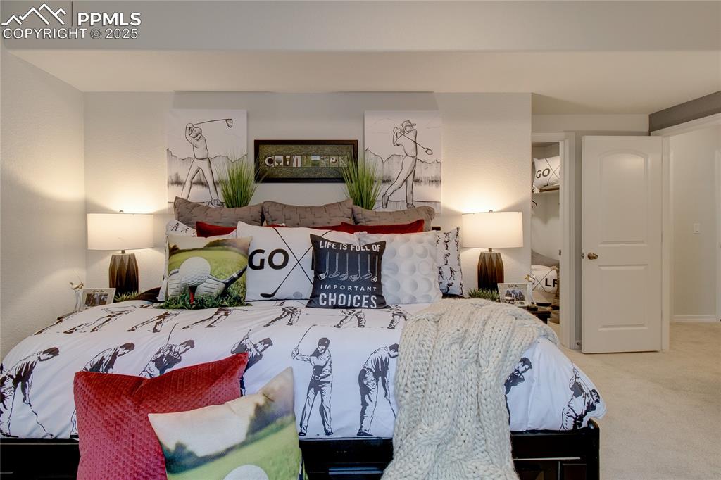 Image 29 of 32: Bedroom with carpet flooring