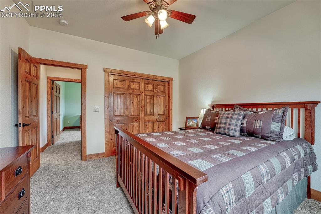 Image 27 of 43: Bedroom featuring light carpet, baseboards, a closet, and a ceiling fan