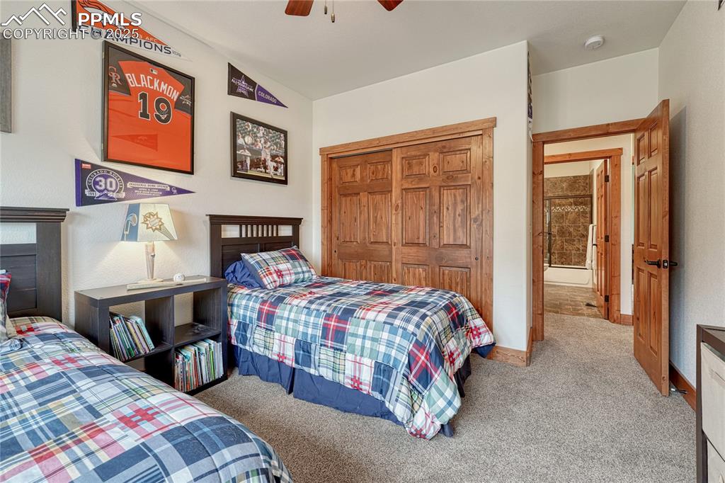Image 32 of 43: Bedroom with carpet floors, a closet, ceiling fan, and baseboards