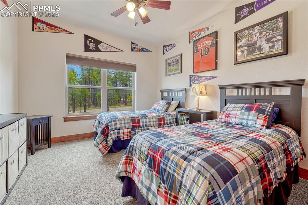 Image 33 of 43: Bedroom featuring carpet floors, baseboards, and a ceiling fan