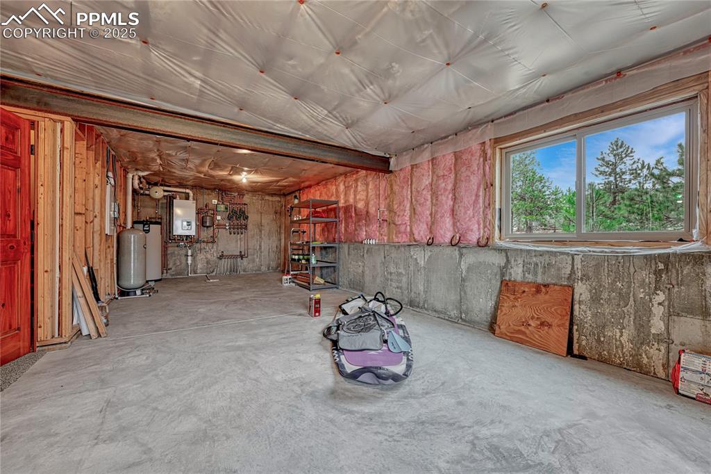 Image 40 of 43: Below grade area featuring water heater