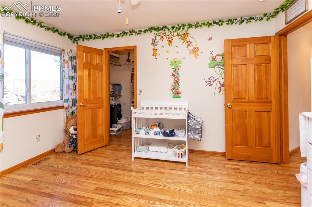 Image 43 of 50: Third bedroom with walk-in closet