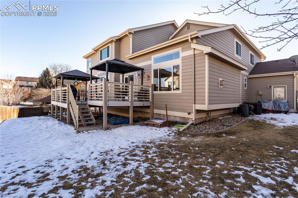 Image 5 of 50: Tiered double deck with composite decking includes the 2 gazebos