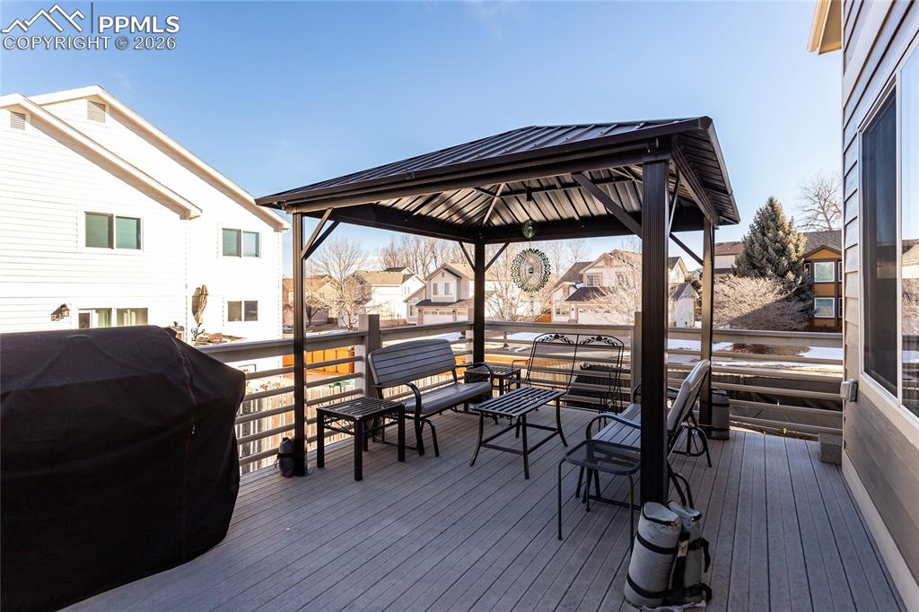 Image 7 of 50: Tiered double deck with composite decking includes the 2 gazebos