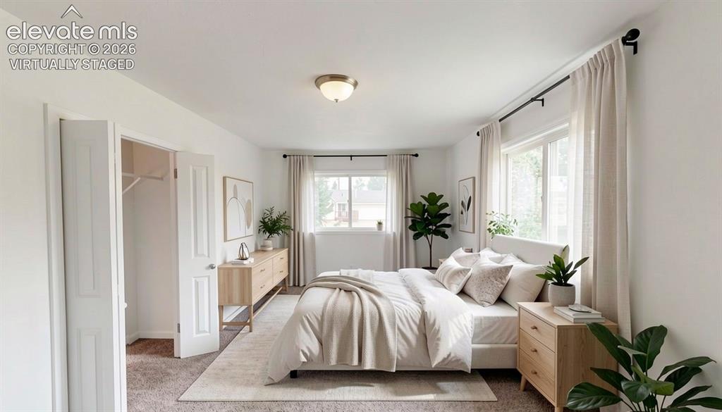 Image 11 of 16: virtually staged.Recessed ceiling light fixture, twin windows with drapery 