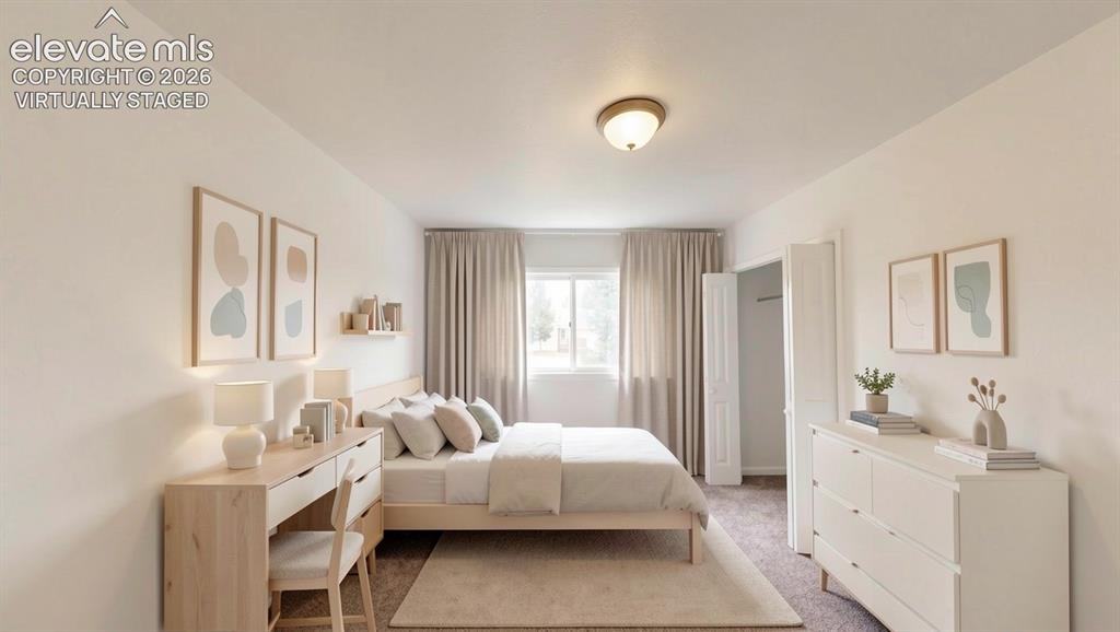 Image 14 of 16: virtually staged.Recessed window with drapes, wall-to-wall carpeting, and a