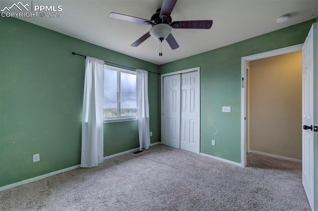 Image 31 of 43: Unfurnished bedroom featuring carpet, baseboards, a closet, and a ceiling f