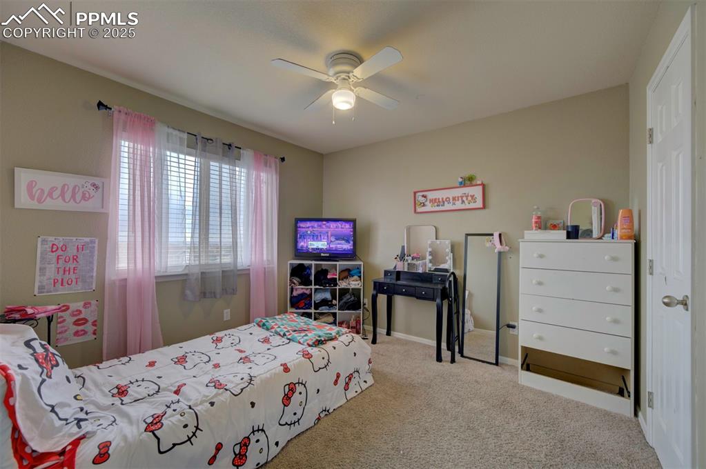 Image 34 of 43: Carpeted bedroom with ceiling fan and baseboards