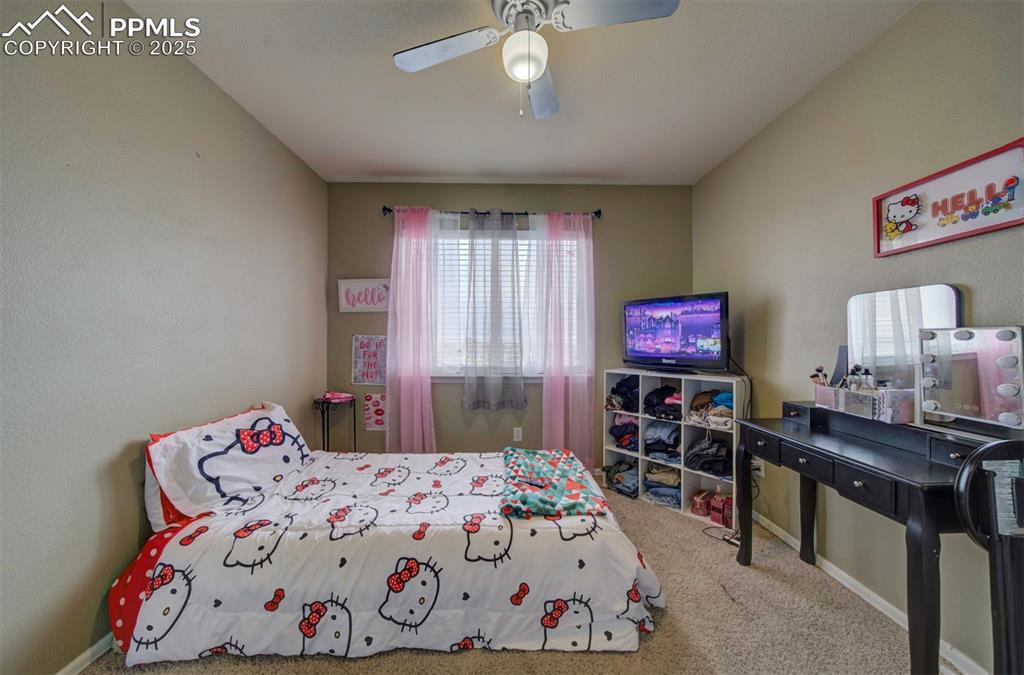 Image 35 of 43: Bedroom featuring carpet flooring, a ceiling fan, and baseboards