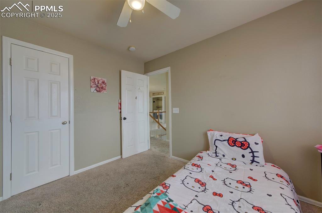 Image 36 of 43: Bedroom with carpet, baseboards, and ceiling fan