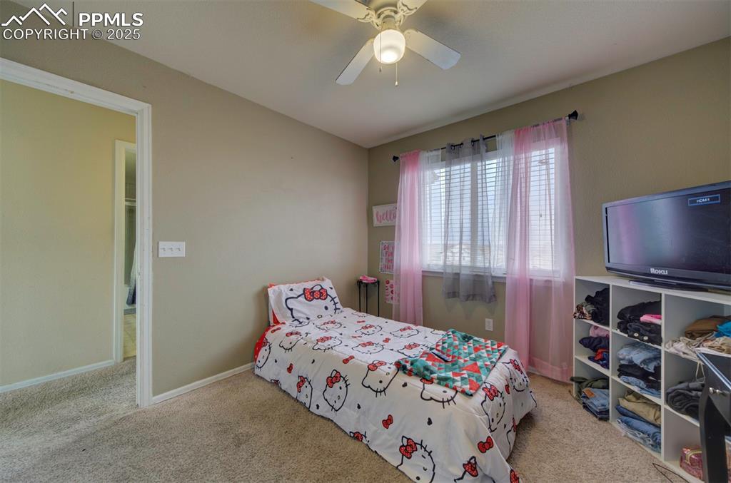 Image 37 of 43: Bedroom featuring carpet floors, ceiling fan, and baseboards