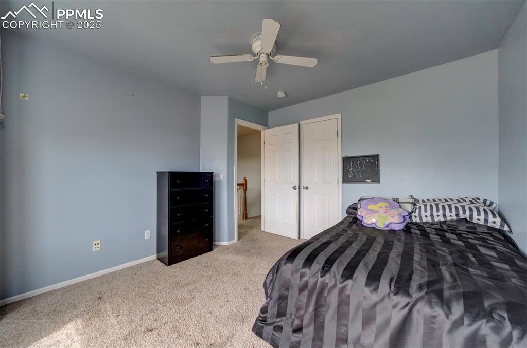 Image 38 of 43: Bedroom featuring carpet, baseboards, and a ceiling fan