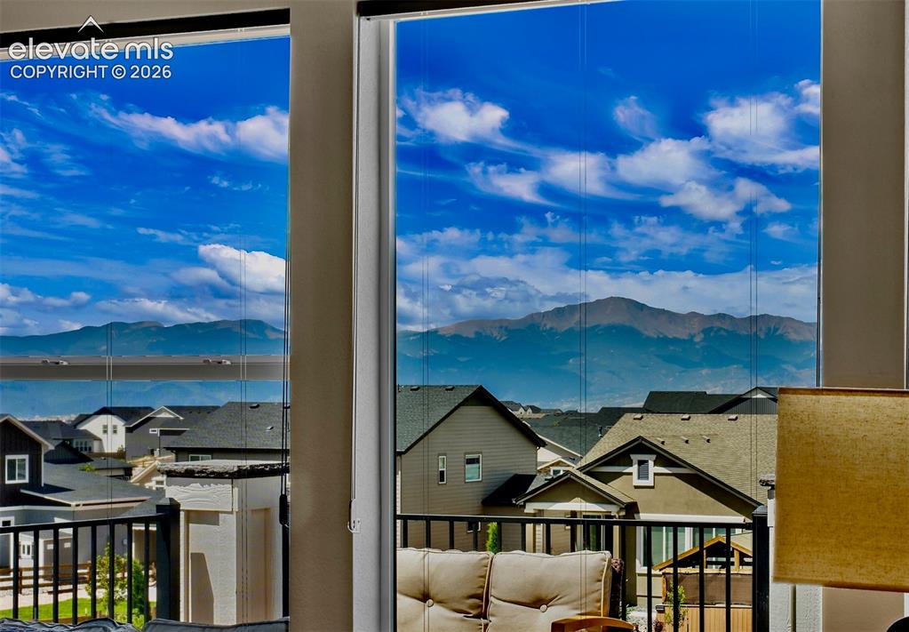 Image 2 of 47: Expansive windows with mountain backdrop