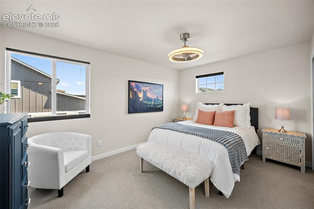 Image 32 of 47: contemporary ceiling fan, dual windows.