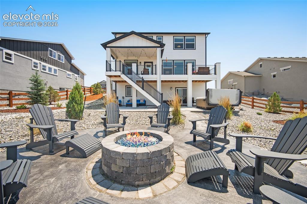 Image 46 of 47: Custom paver patio with a built-in fire pit