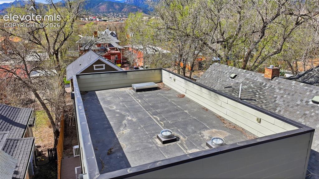 Image 47 of 50: This home offers a rare possibility of a rooftop patio. The water and plumb