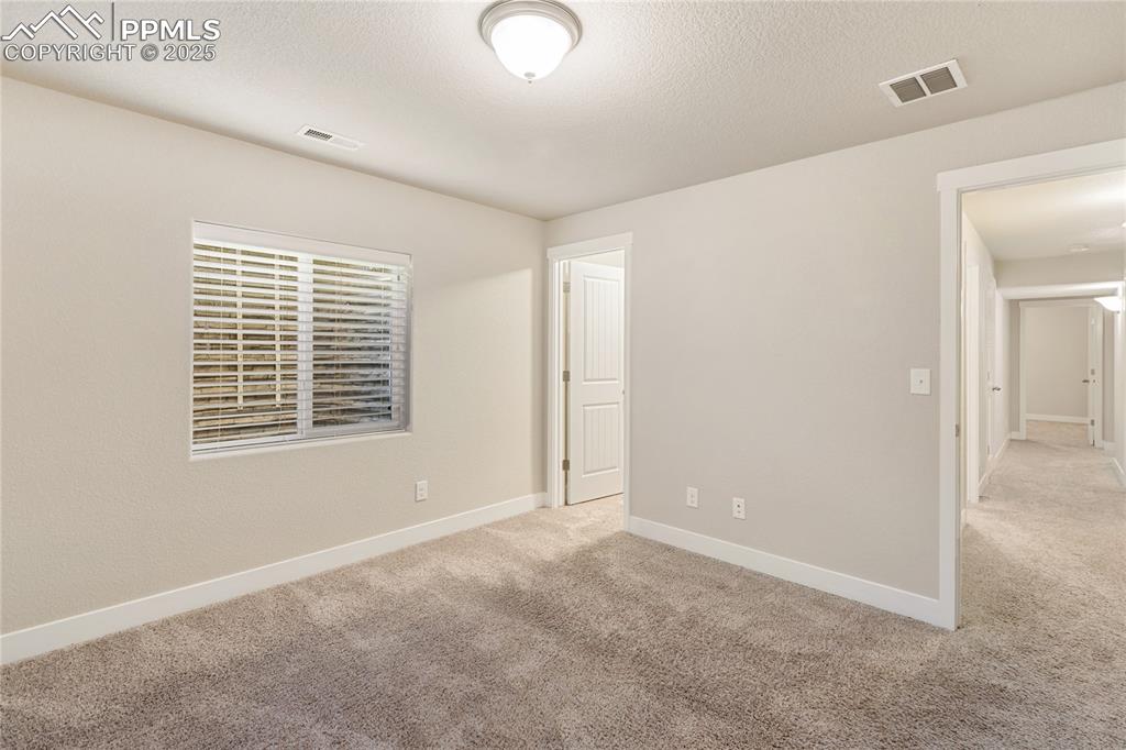 Image 28 of 31: Second of two bedrooms on the lower level
