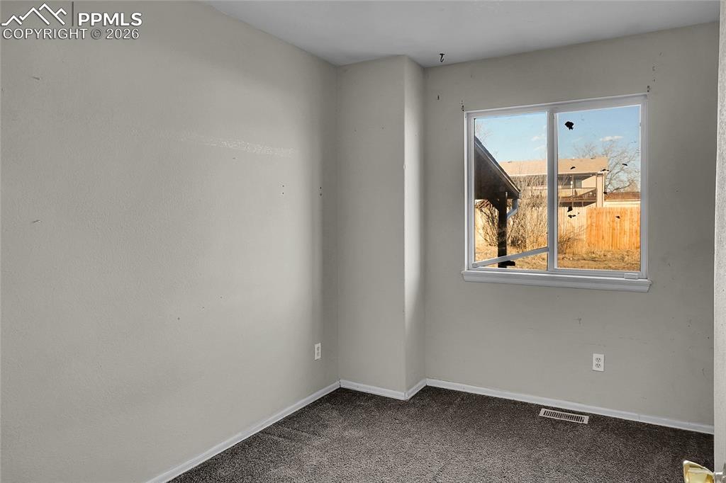 Image 11 of 33: Main level bedroom 3