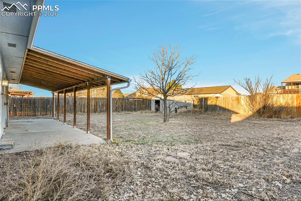 Image 27 of 33: Shed, covered patio