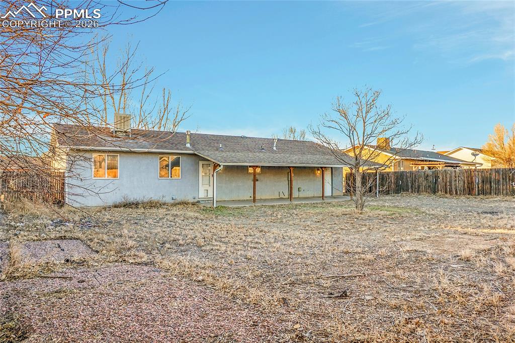 Image 28 of 33: Large concrete covered patio