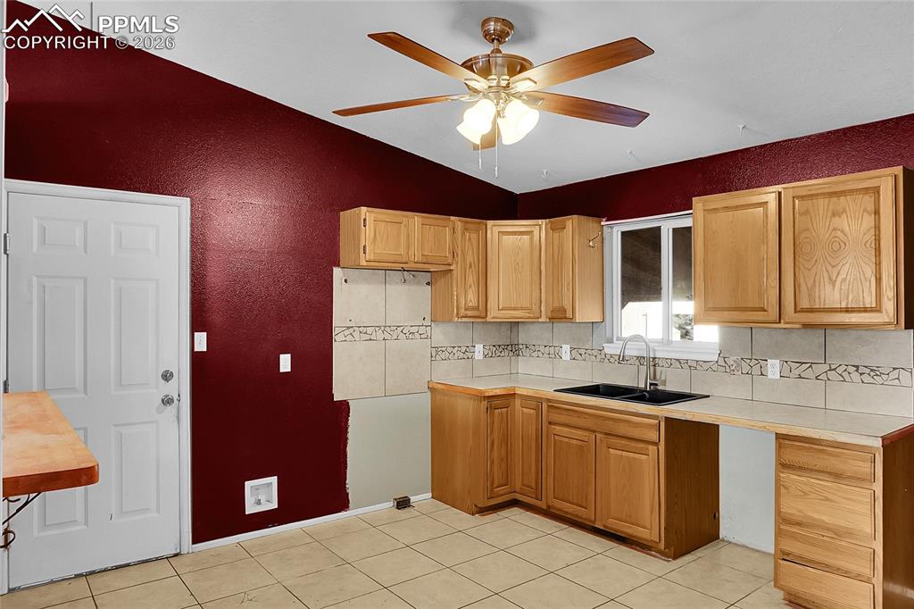 Image 7 of 33: Garage entry to the left