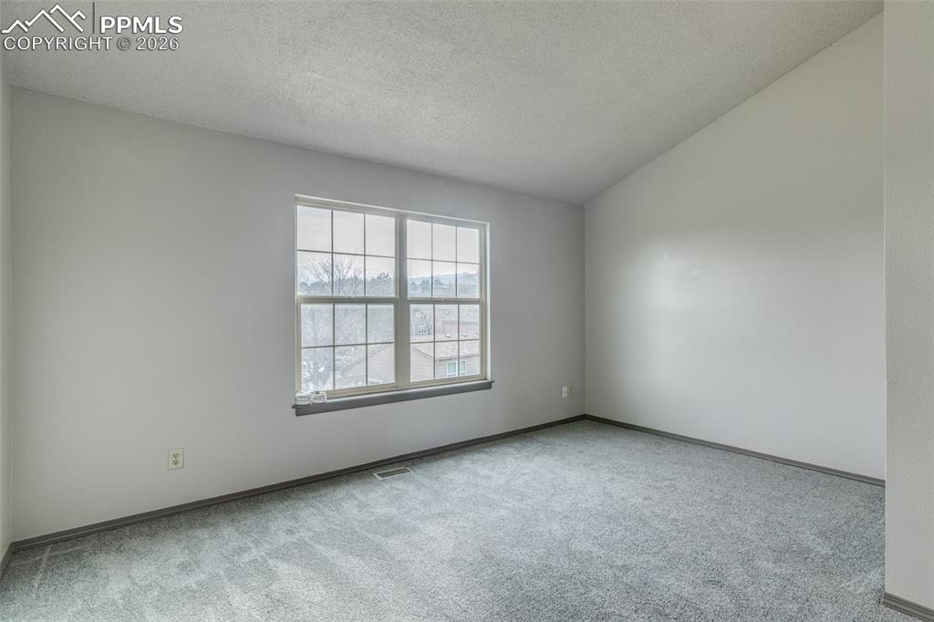 Image 13 of 33: Upper level west facing, primary bedroom 